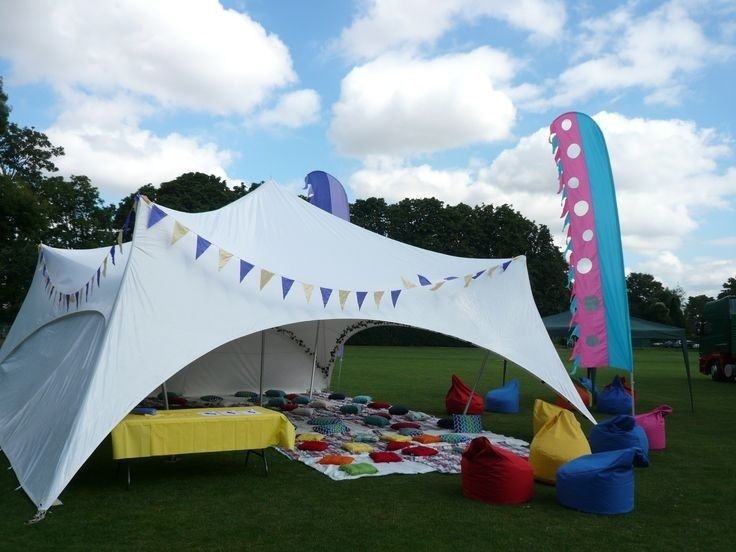 Colorful festival relaxation tent with cushions and beanbags outdoors